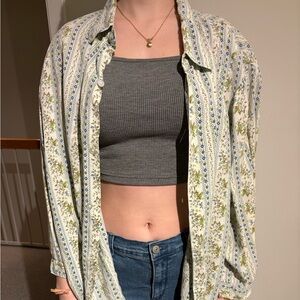 Floral women’s button-down. White with green and blue floral patterns.